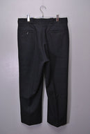 COMOLI ウールサージパンツ