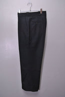 COMOLI ウールサージパンツ